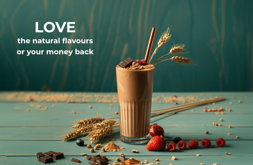 A glass of Queal shake with natural ingredients such as wheat, berries, and chocolate on a wooden surface. Text reads, "LOVE the natural flavours or your money back."